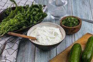 healthy cucumber and yogurt snack with fresh greens for weight loss