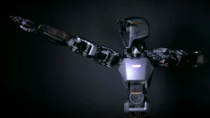 Phoenix humanoid robot with extended robotic arms in a dark futuristic background.