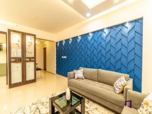 Modern living room with a blue textured accent wall and neutral furniture.