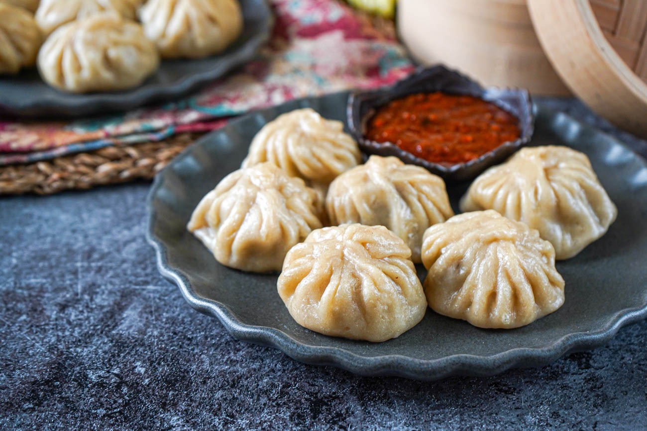 chinese cuisine momos served beautifully on a table