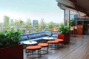SKAI rooftop restaurant in Kolkata with stylish outdoor seating, city skyline views, and a vibrant dining atmosphere.
