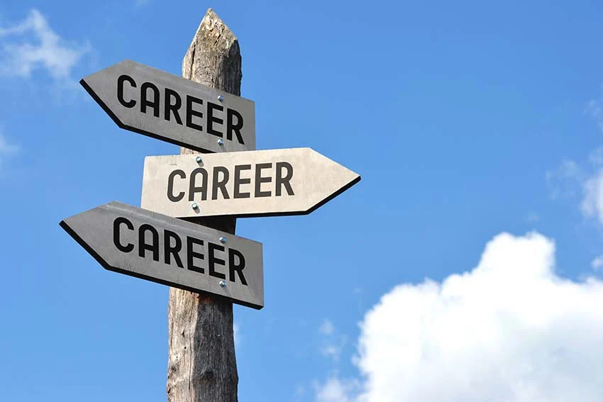 Career direction signpost with three arrows pointing in different directions