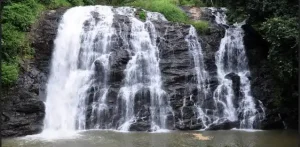Abbey Falls, one of the scenic Coorg tourist places surrounded by lush green forests.
