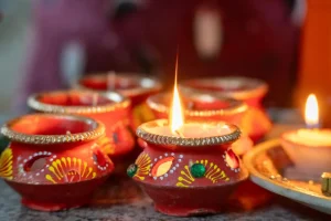 Colorful-handmade-diyas- decorated-with- intricate-traditional- Indian-patterns