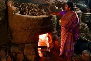 Traditional- terracotta-diyas- being-fired-inside- a- brick-kiln-at-a- pottery-workshop